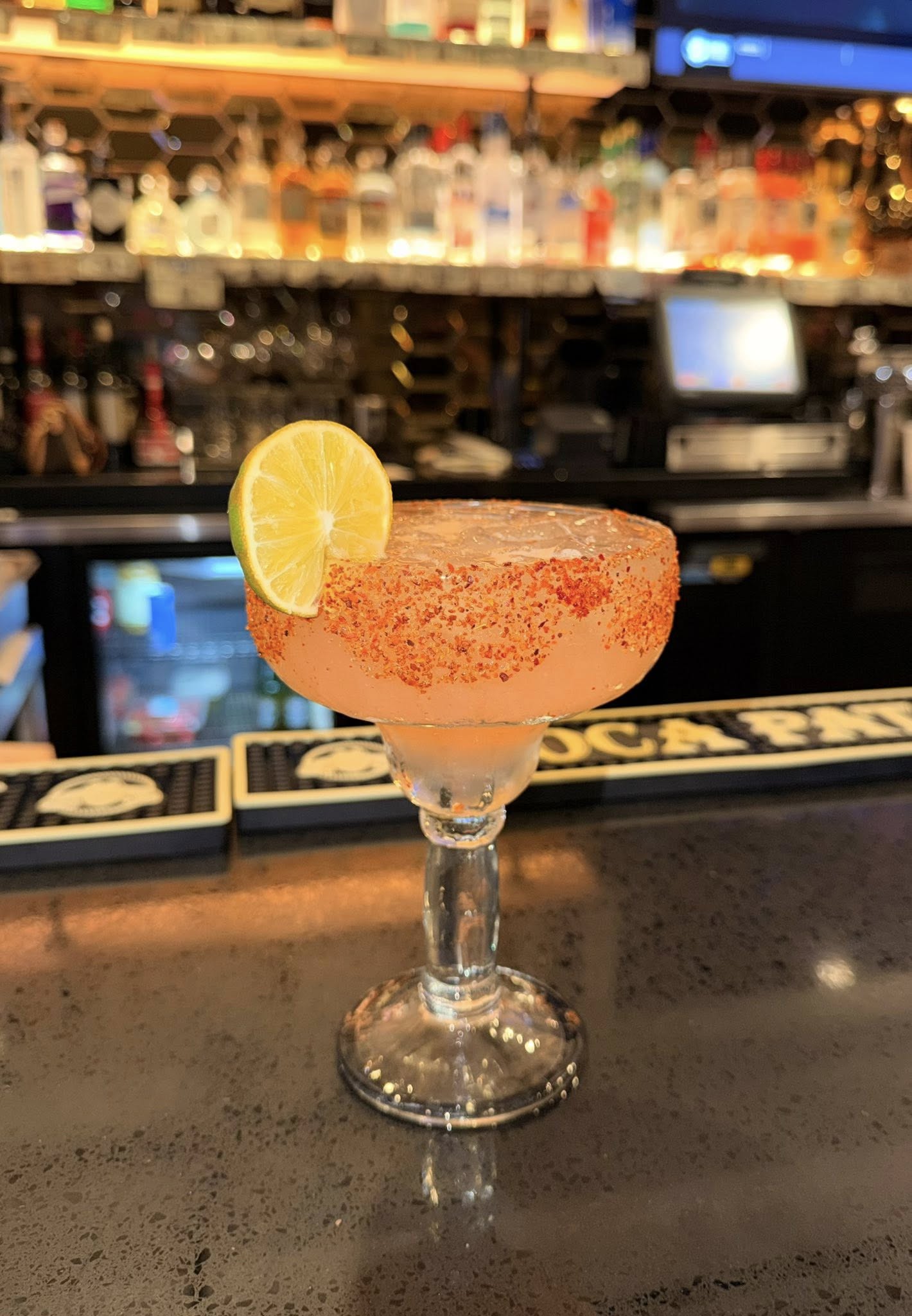 Chili-lime rimmed margarita with a lime wheel